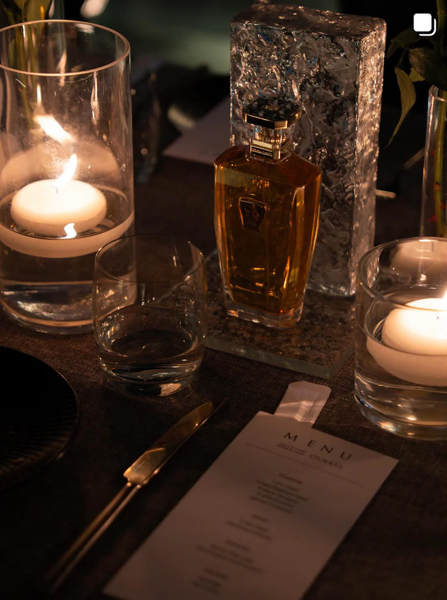 The Light Oud bottle and its ridged silver cap